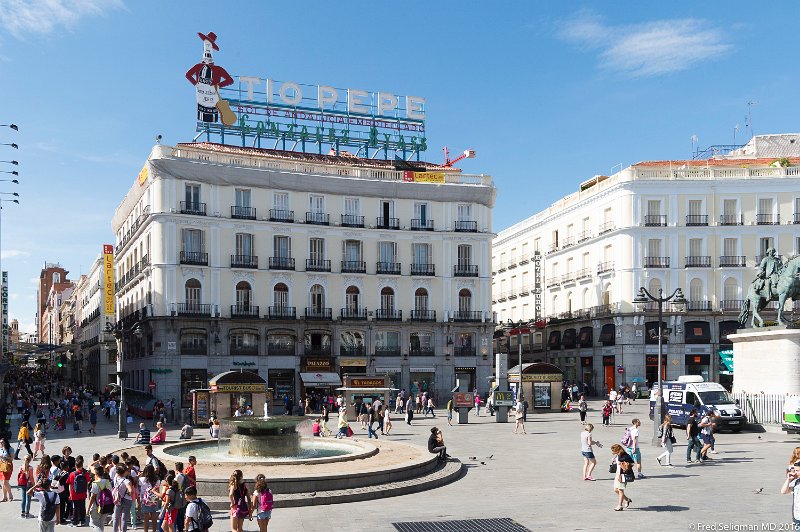 20160606_174826 D4S.jpg - The Tio Pepe has been a landmark in Peurta del Sol, the famous Madrid square.  Since 1936 it was atop number 1, and in 2009 it was granted a pardon to remain atop the building in perpetuity.  Come 2012 and Apple renovates the building for its new store and in the process the Tio Pepe sign was taken down.  Three years later (2014) it was relit at number 11, its current home.